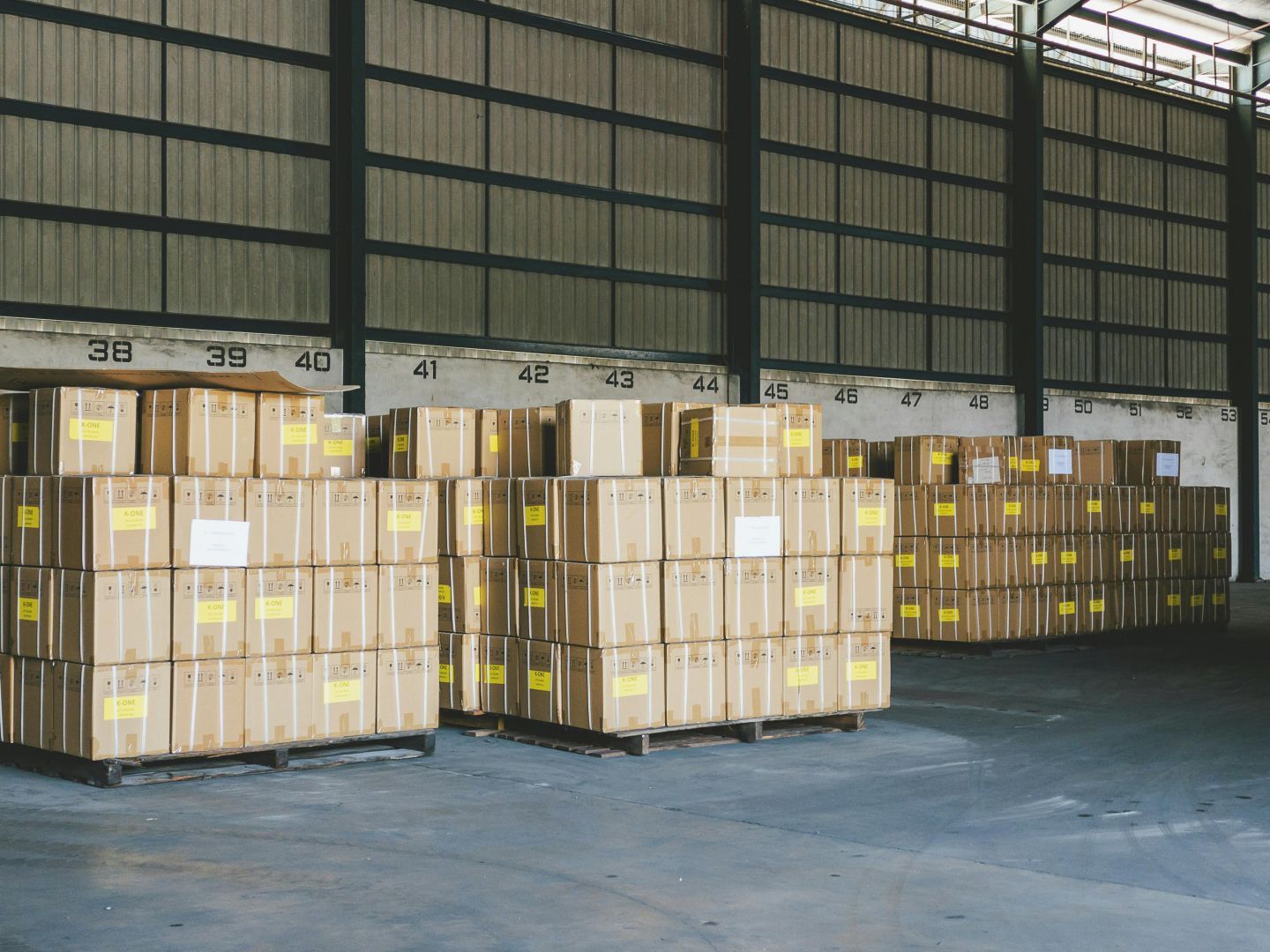 Warehouse with stacked containers